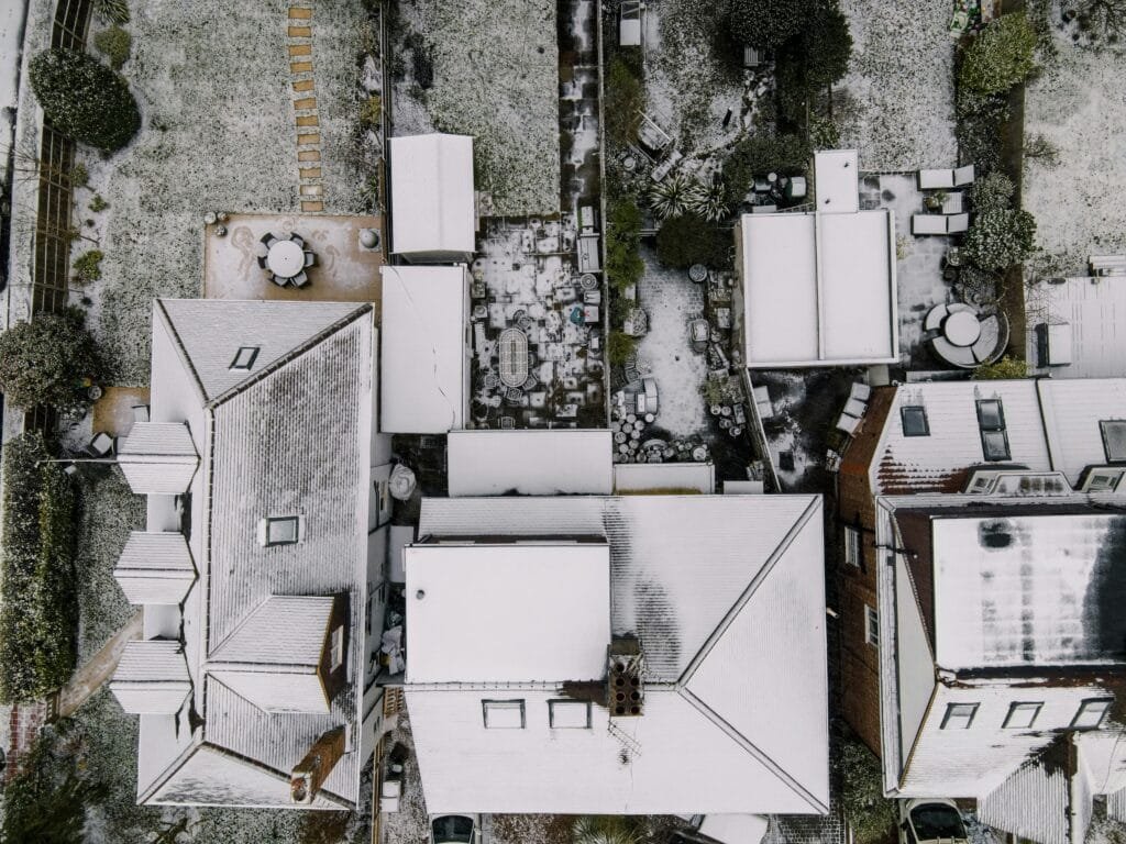 Aerial View of Snow Covered Roof in Grayscale Photography